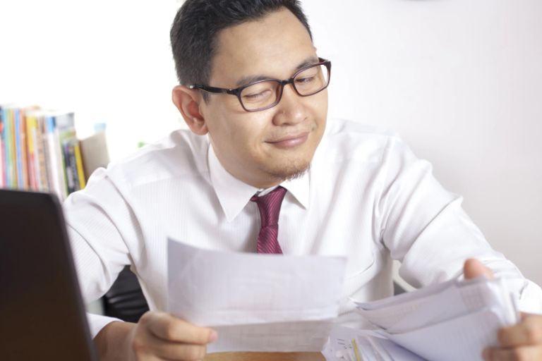 A focused professional managing Philippine tax forms and simplify BIR compliance for their business.